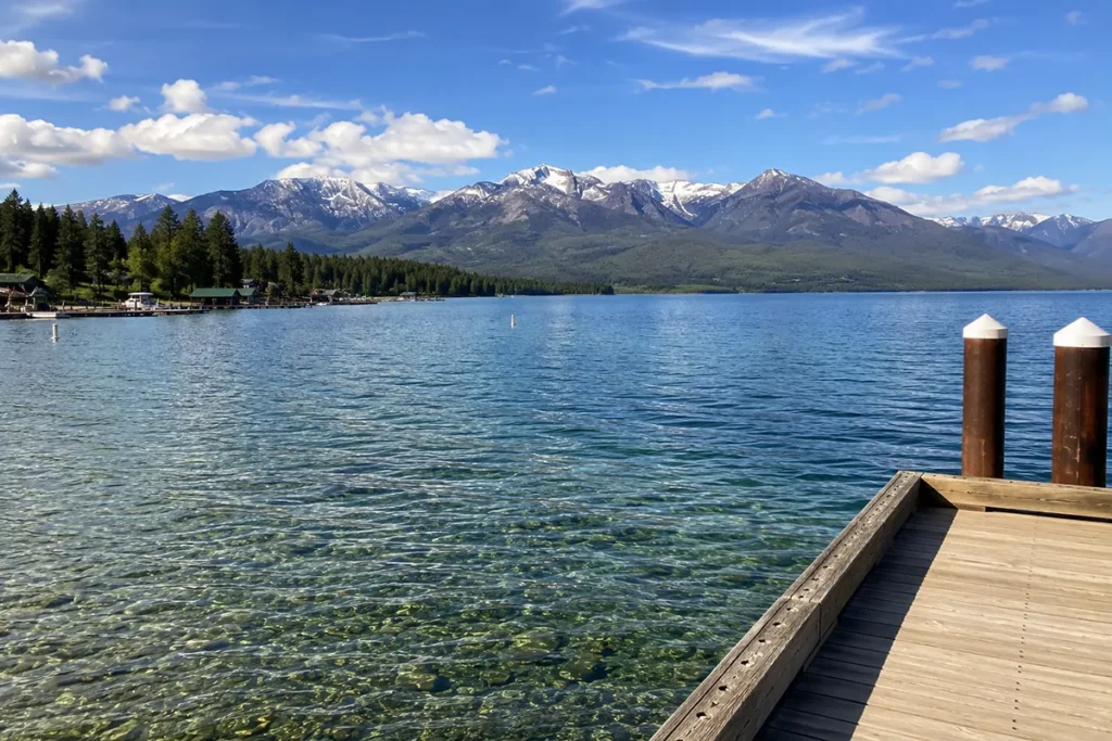 Flathead Lake from Wayfarers State Park in Bigfork Montana with Swan Range mountains and clear blue water