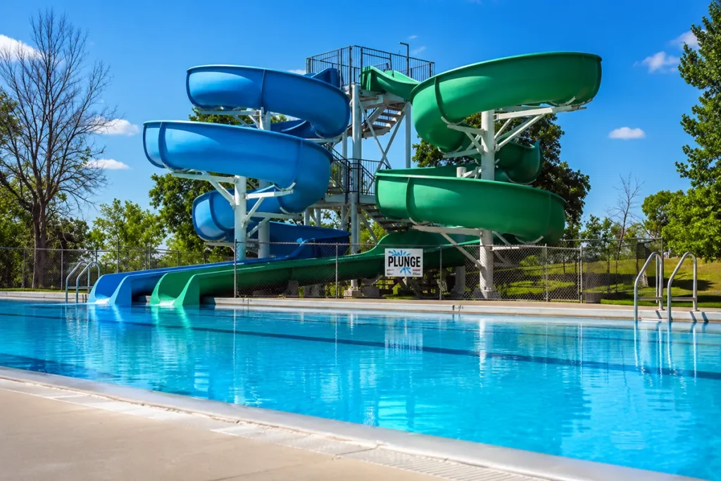 Power Tower Plunge water slides at Electric City Water Park Great Falls Montana with children descending into the Mitchell Pool