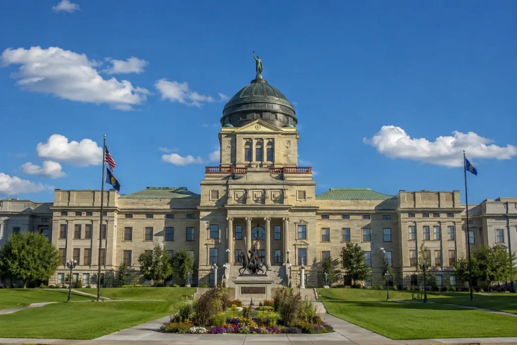Montana State Capitol building in Helena with copper dome against blue sky