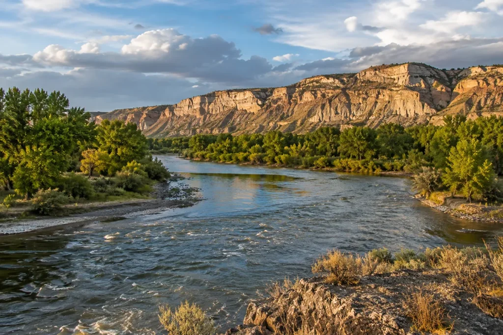 Yellowstone River winding through Billings Montana with the Rimrocks visible in the distance