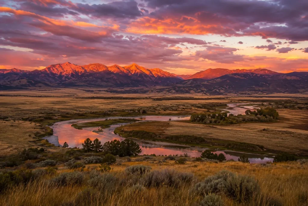 Sunset over the Yellowstone River and the mountains of Paradise Valley north of Gardiner Montana