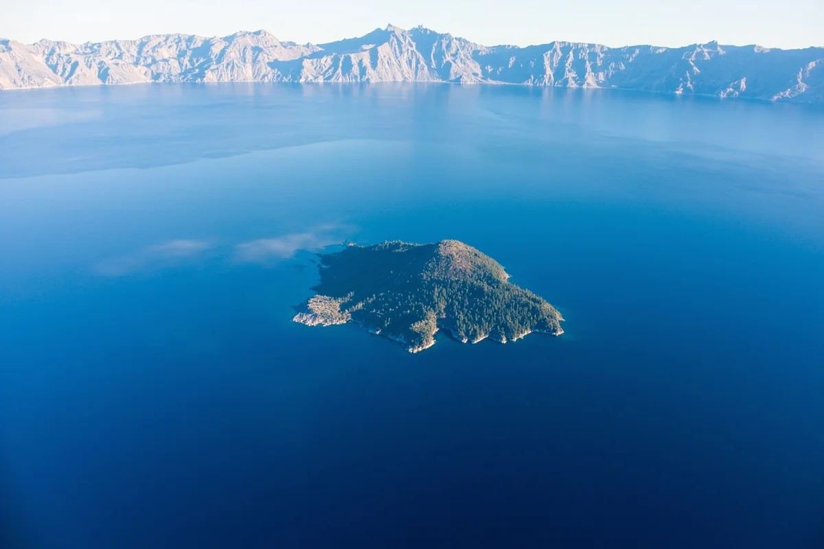 Aerial view of Crater Lake's deep blue waters and Wizard Island