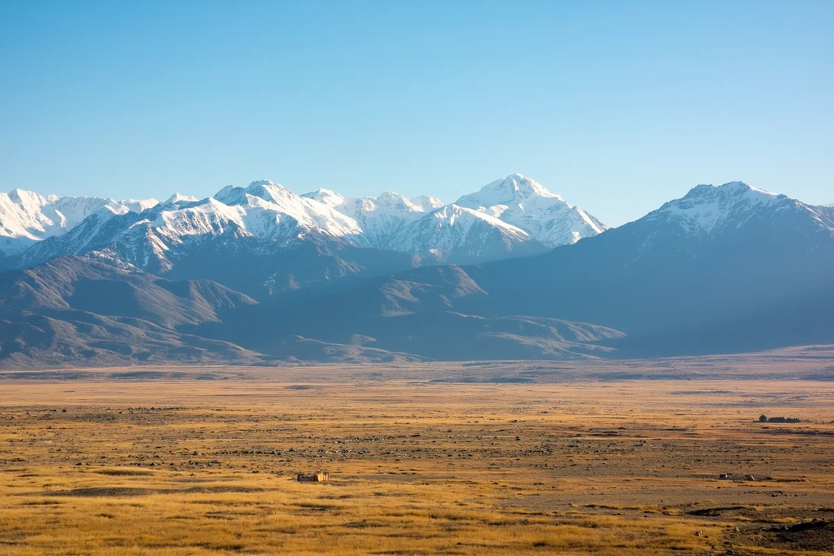 Aerial view of Montana's vast plains meeting the Rocky Mountains, showcasing the state's enormous scale