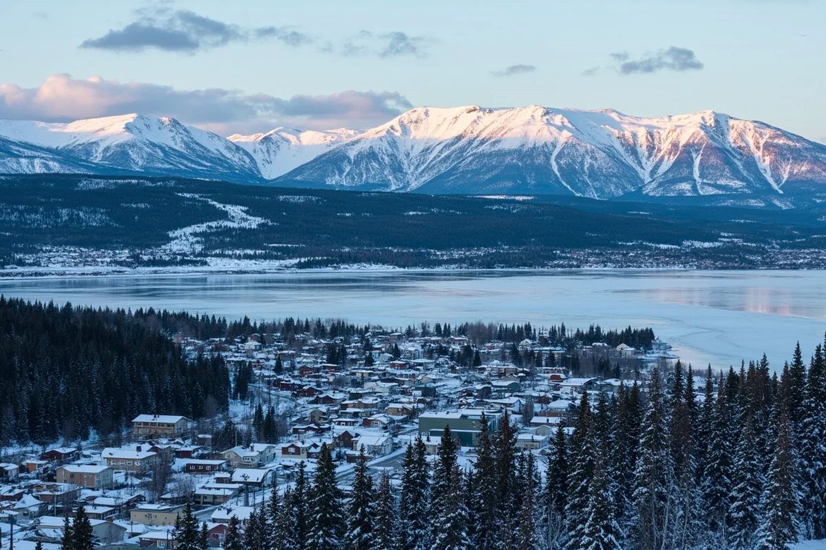 Aerial view of Whitefish town with frozen lake and Whitefish Mountain Resort in background