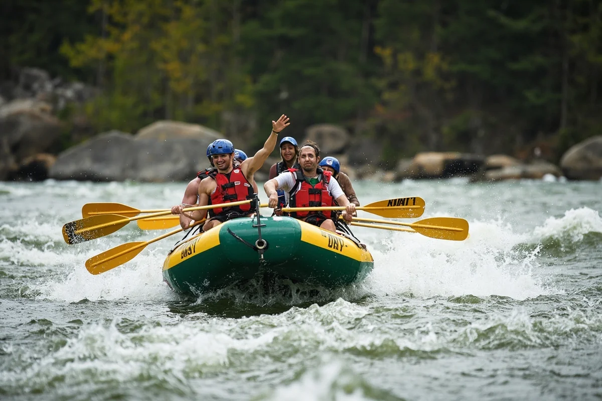 Bachelorette party group in a raft navigating whitewater rapids on the Gallatin River