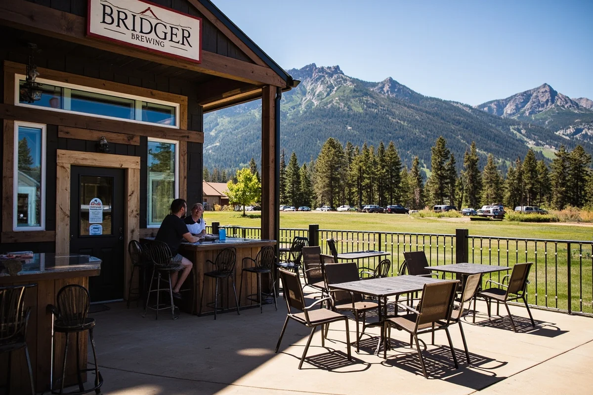Bridger Brewing exterior with mountain backdrop and outdoor patio seating