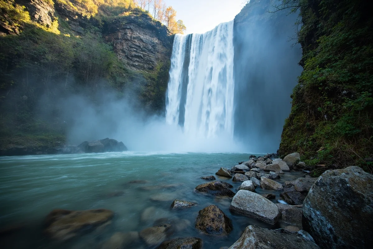 Close-up of Pioneer Falls from base with mist and rocky pool
