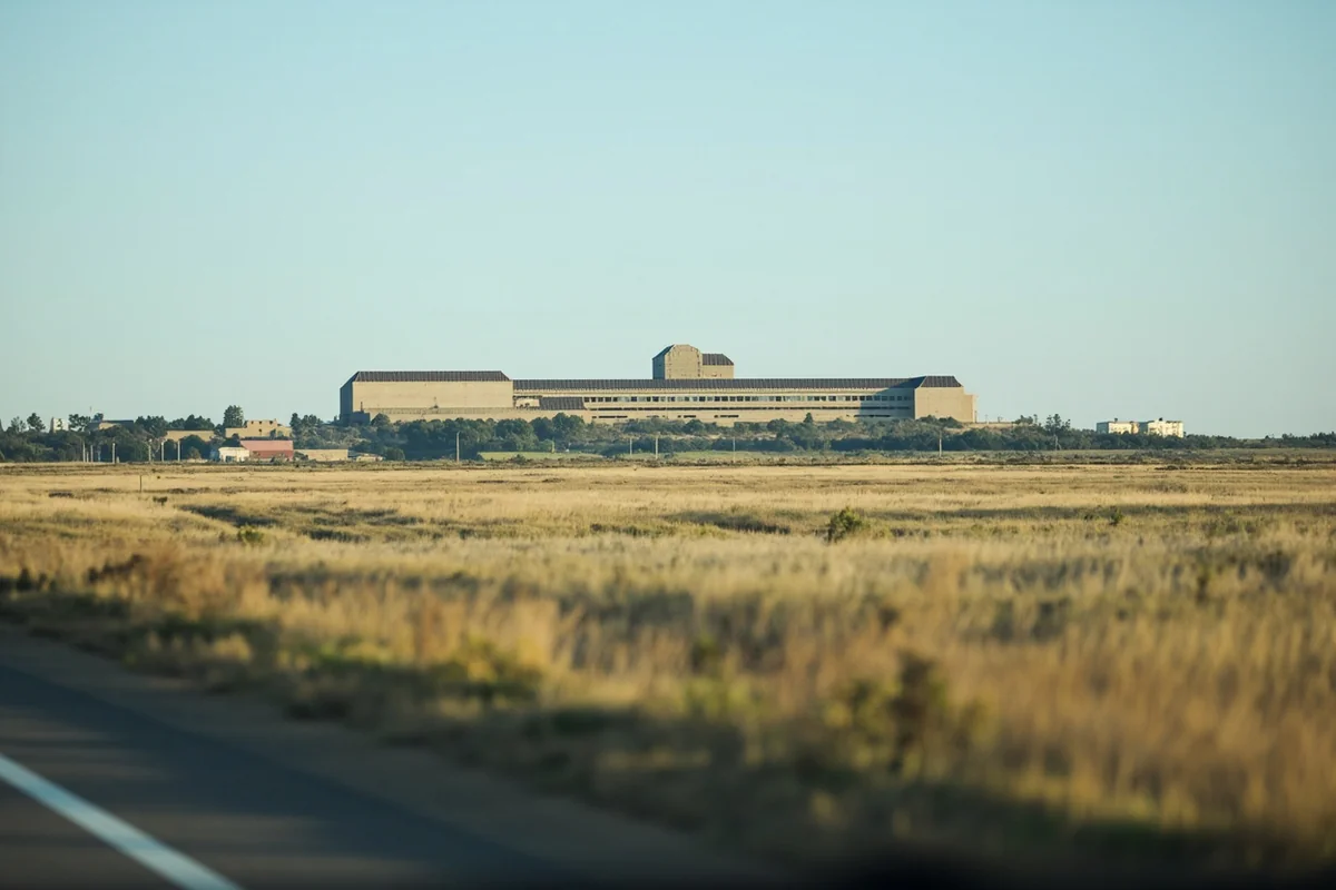 Distant view of the modern Montana State Prison facility from the highway