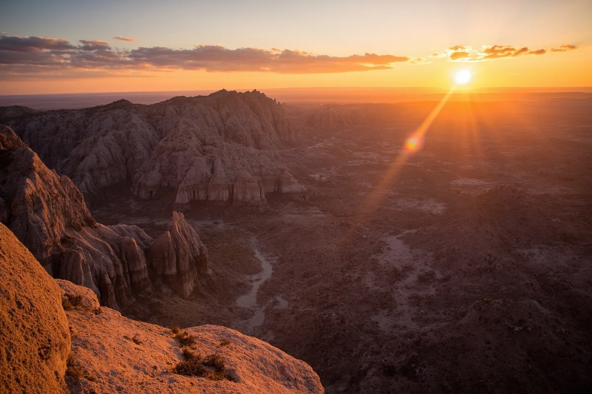 Dramatic badlands rock formations viewed from helicopter at sunset