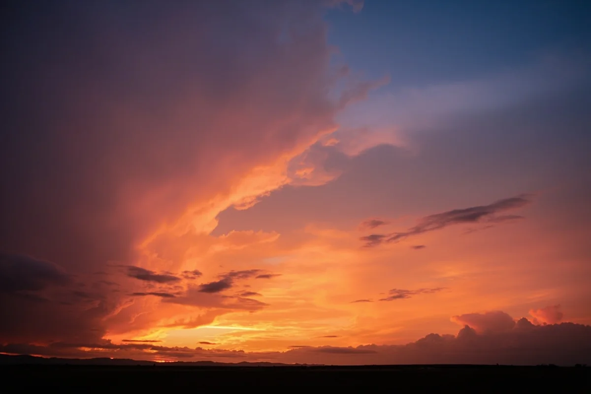 Dramatic Montana sunset with massive cloud formations stretching across an endless horizon
