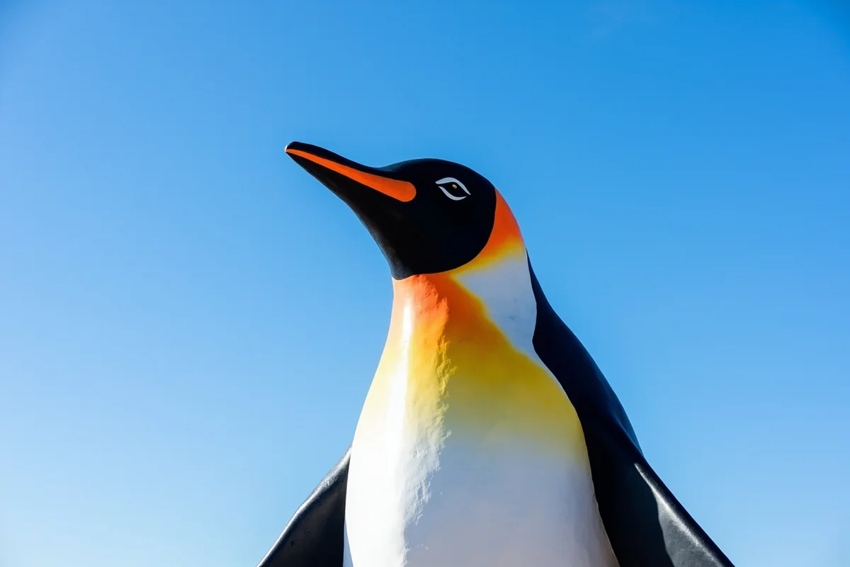 Giant penguin statue in Cut Bank, Montana against blue sky