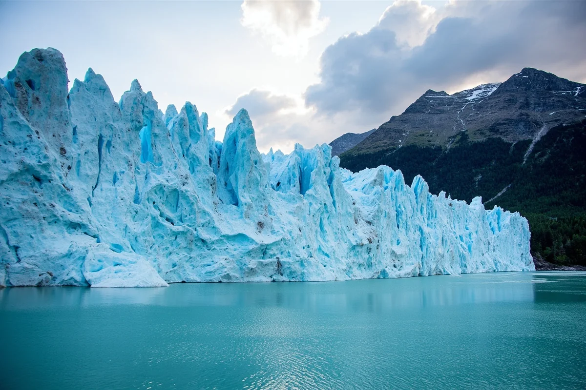 Grinnell Glacier in Glacier National Park showing the receding ice and turquoise meltwater lake