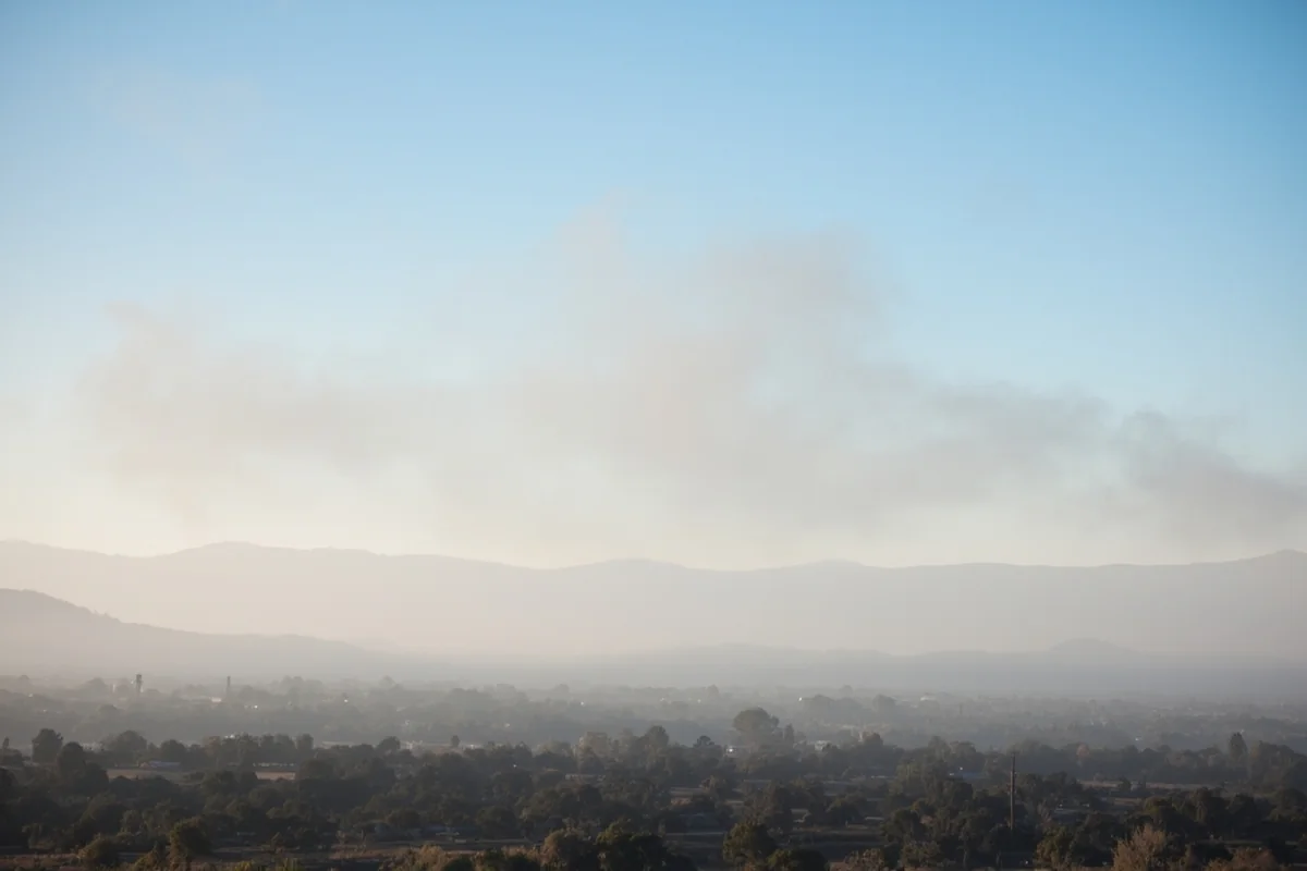 Hazy smoke filling the Seeley-Swan Valley with mountains barely visible in background