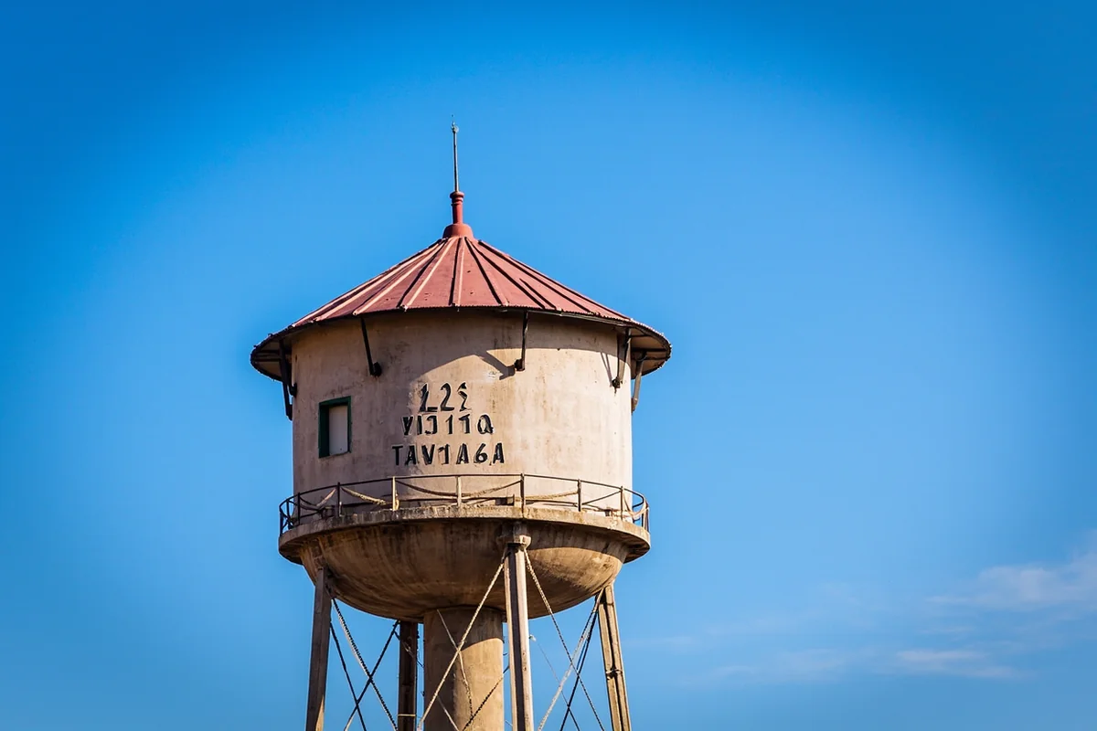 Historic water tower in downtown Bozeman with blue sky background