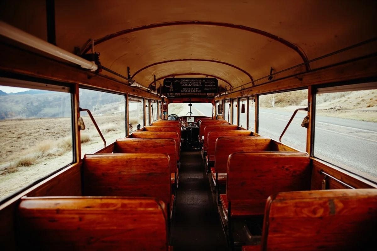 Interior view of vintage Red Bus showing wooden seats and roll-back canvas roof