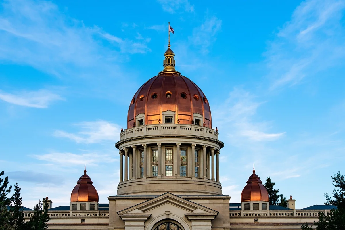 Montana State Capitol building in Helena with its copper dome against blue sky
