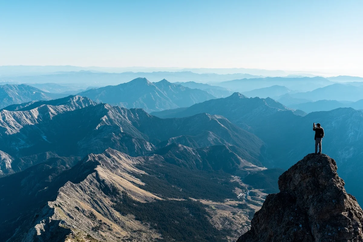 Panoramic view from Lone Peak summit showing multiple mountain ranges