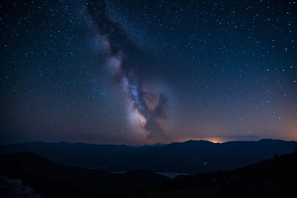 Panoramic view of Montana night sky with Milky Way over mountain range