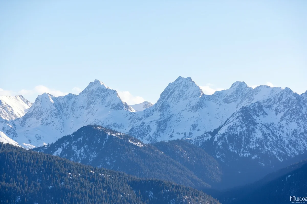 Snow-covered mountain peaks in the Beartooth Range showing elevation changes