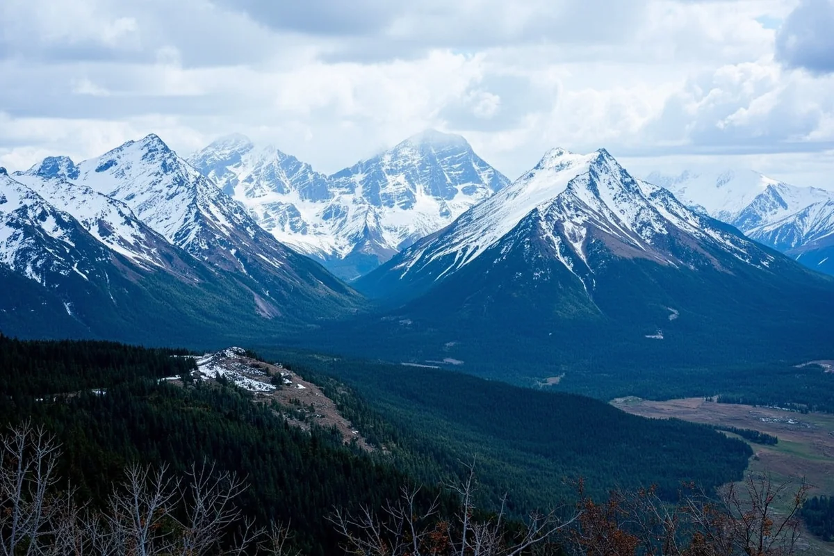 Snow-covered peaks of the Mission Mountains in western Montana with forested valleys