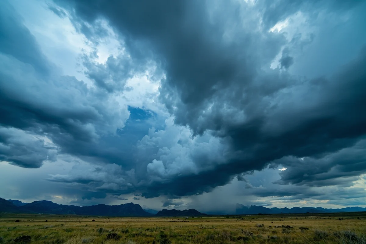 Storm clouds gathering over the Rocky Mountain Front near Choteau, Montana, showing dramatic weather without tropical characteristics