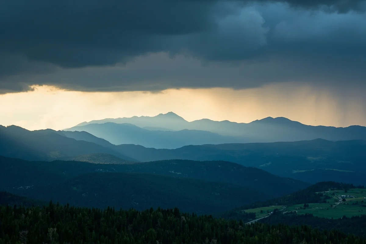 Summer thunderstorm over Montana's mountain ranges with dramatic lighting