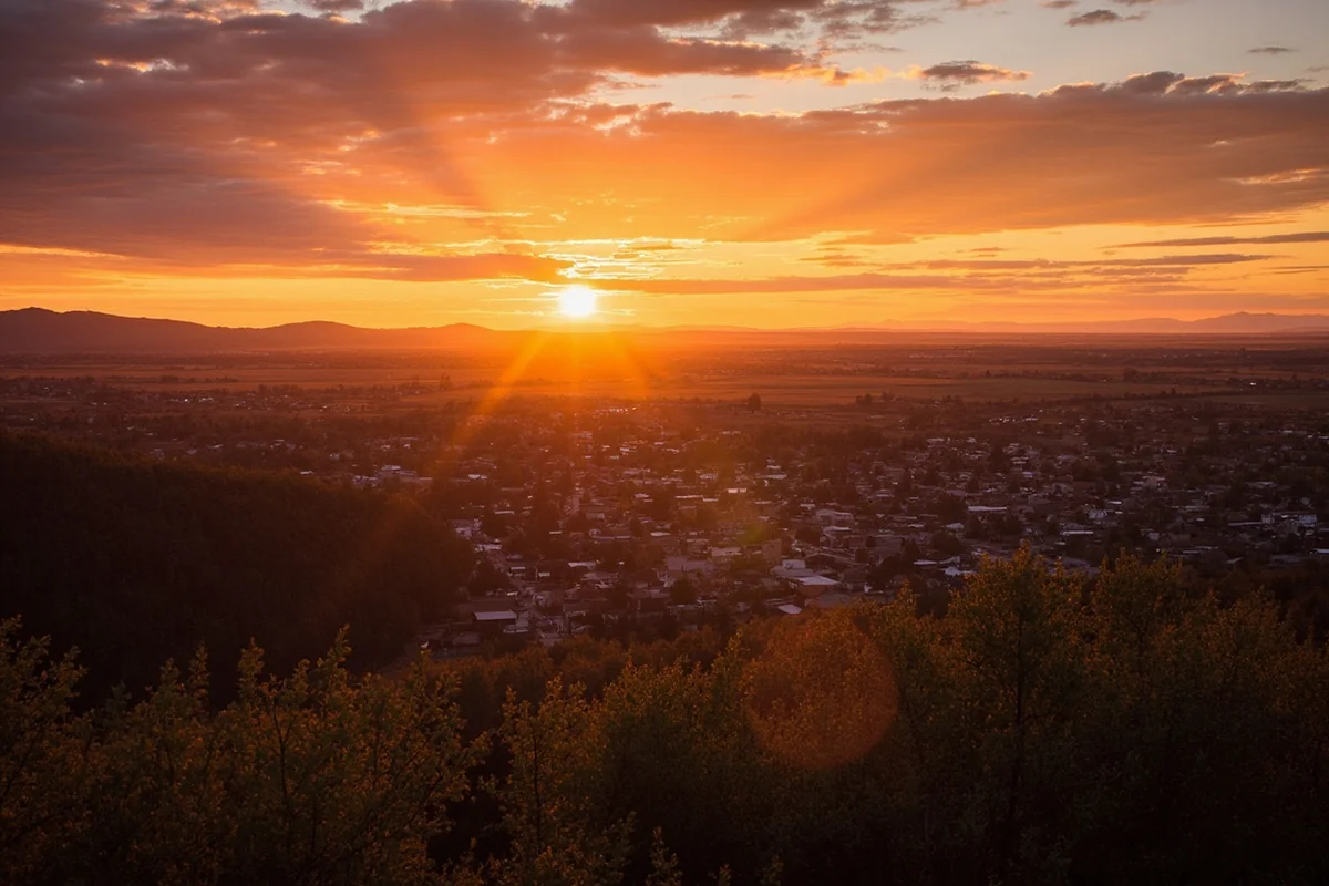 Sunset over a Montana small town, conveying the peaceful atmosphere that defines safe communities here