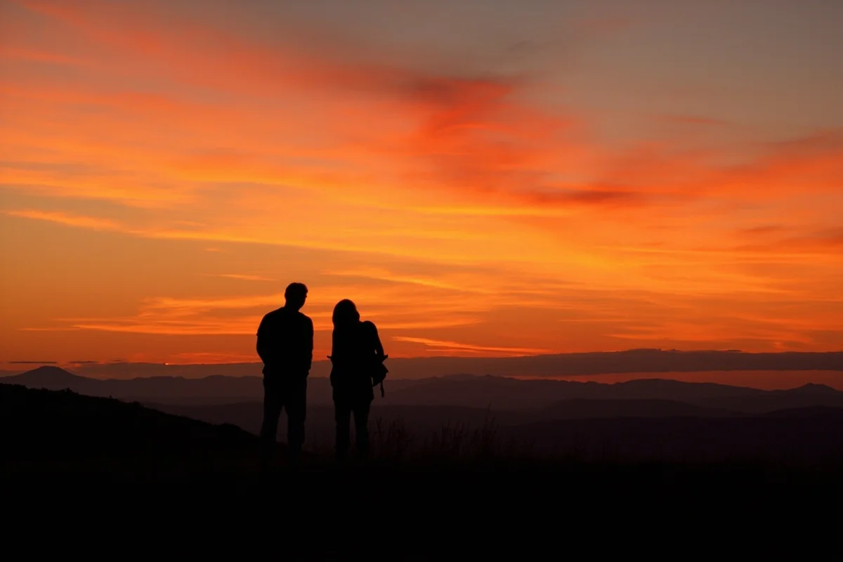 Sunset over Montana landscape with couple silhouette