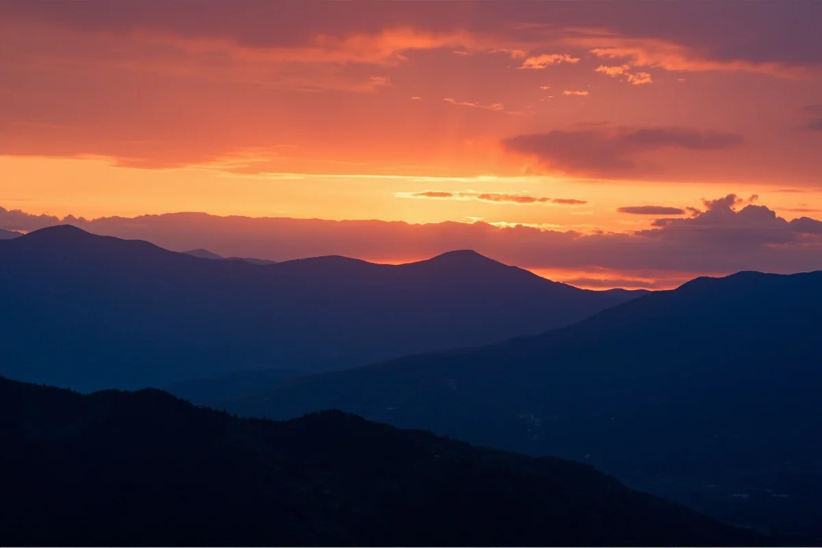 Sunset over Montana mountains, suggesting the timeless beauty of a landscape shaped by geological forces including earthquakes