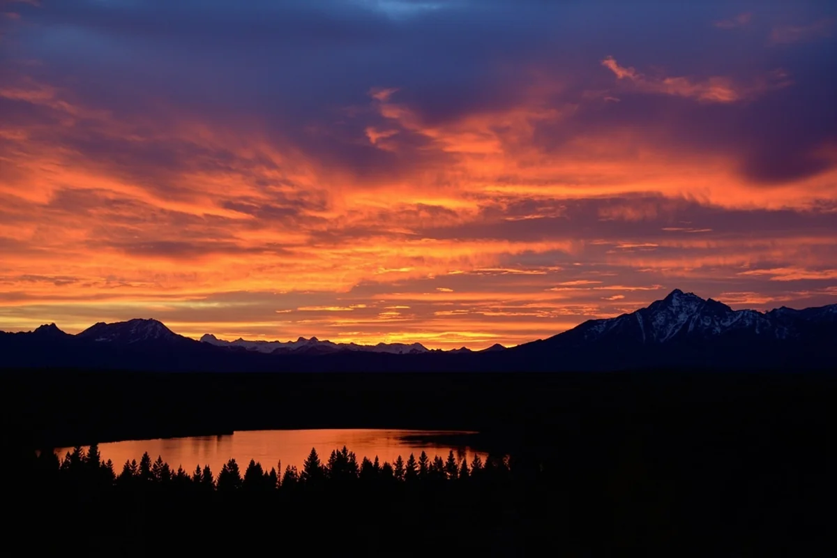 Sunset view from Two Medicine Lake area with dramatic mountain silhouettes