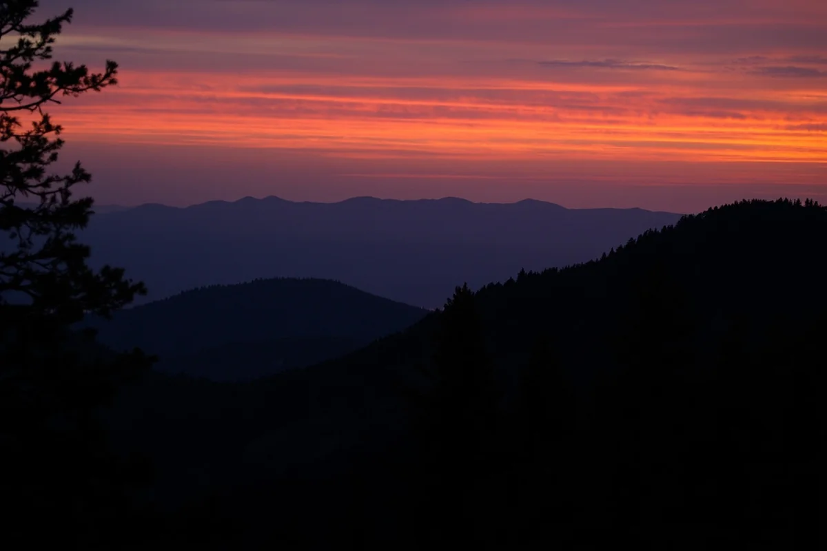 Sunset view over Bob Marshall Wilderness with mountain silhouettes
