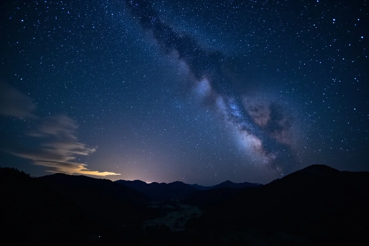 The Milky Way visible above Montana's mountains showcasing the dark sky advantage of this inland state