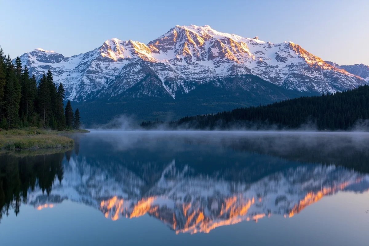 Two Medicine Lake with Rising Wolf Mountain reflection in early morning light
