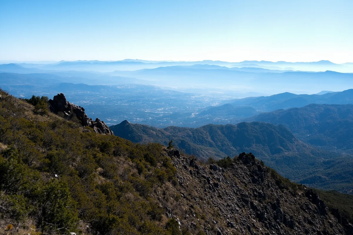 View from Mount Helena ridge trail showing the sprawling valley and distant mountain ranges