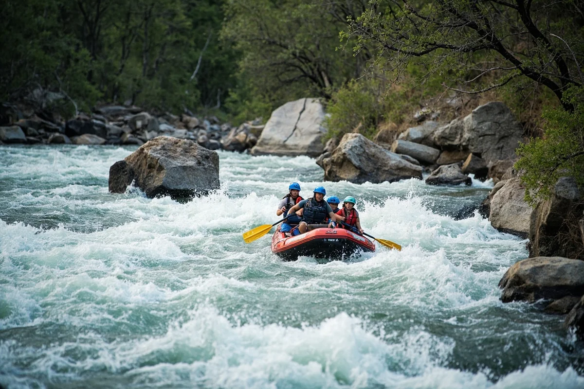 Whitewater rafters navigating rapids in the Gallatin Canyon