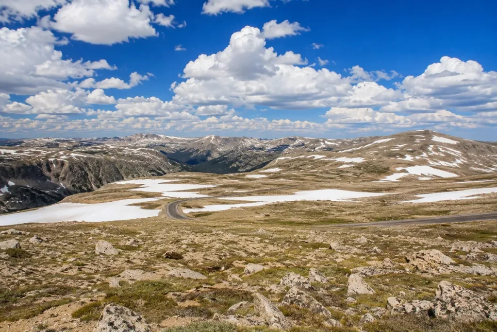 Beartooth Pass summit at 10,947 feet with alpine tundra and snow in Carbon County Montana