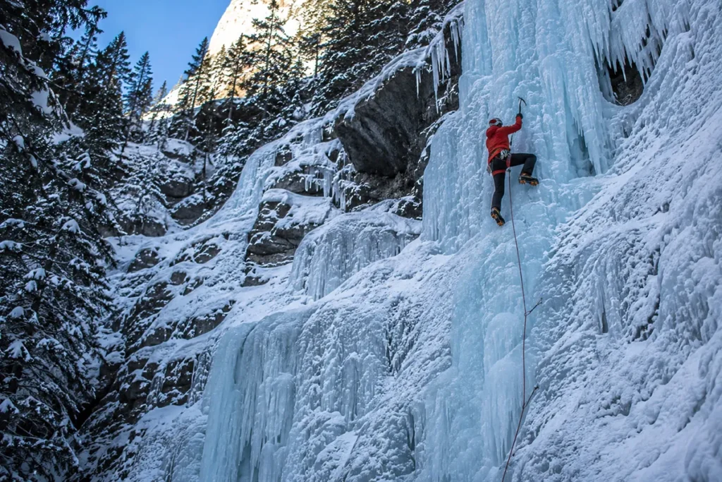 Ice climber on a frozen waterfall in Hyalite Canyon Montana