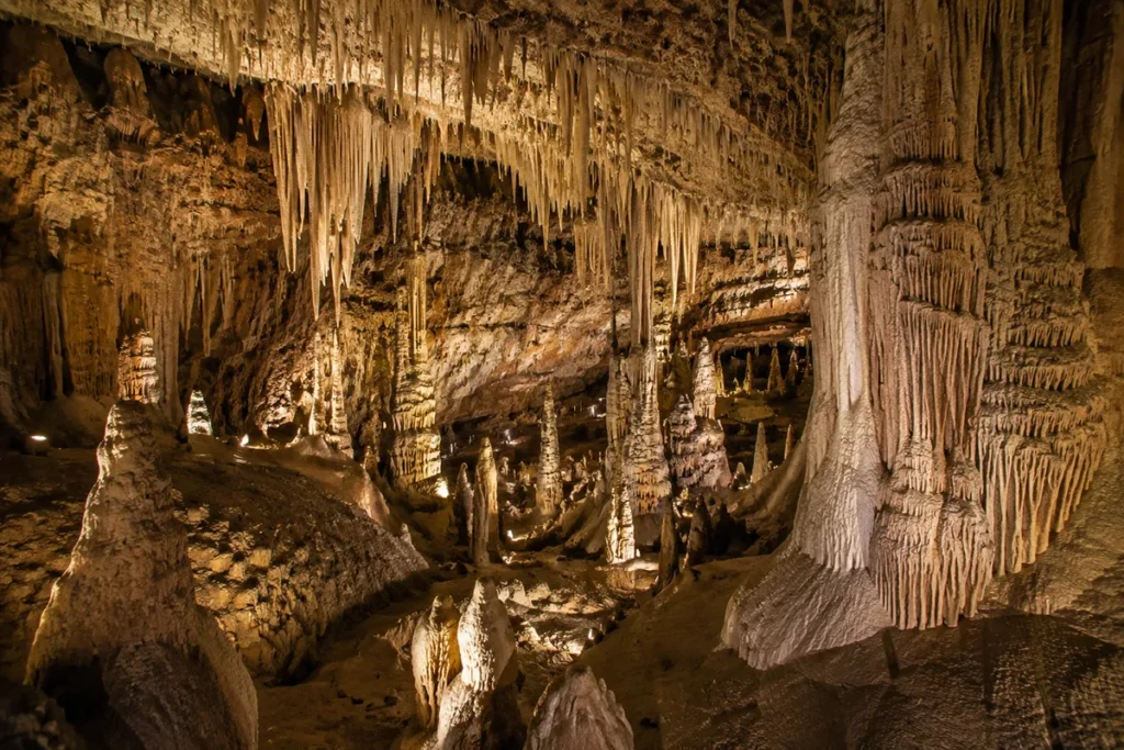 Limestone formations inside Lewis & Clark Caverns State Park in Montana, showing stalactites, stalagmites, and chamber walls