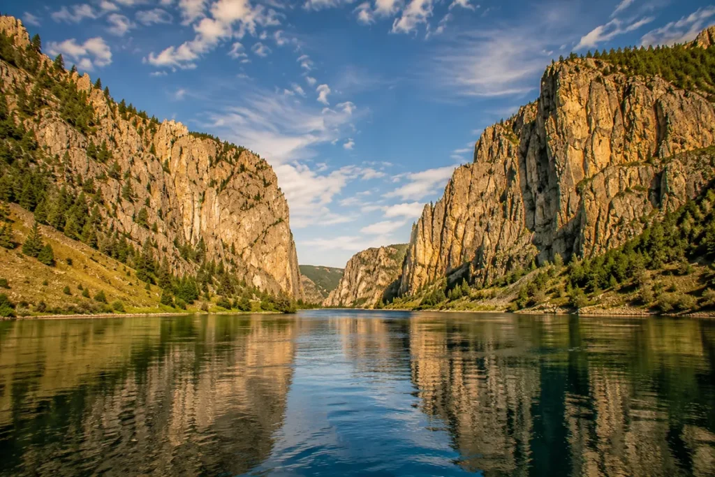Limestone cliffs rising vertically from the Missouri River at the Gates of the Mountains in Montana's Big Belt Mountains