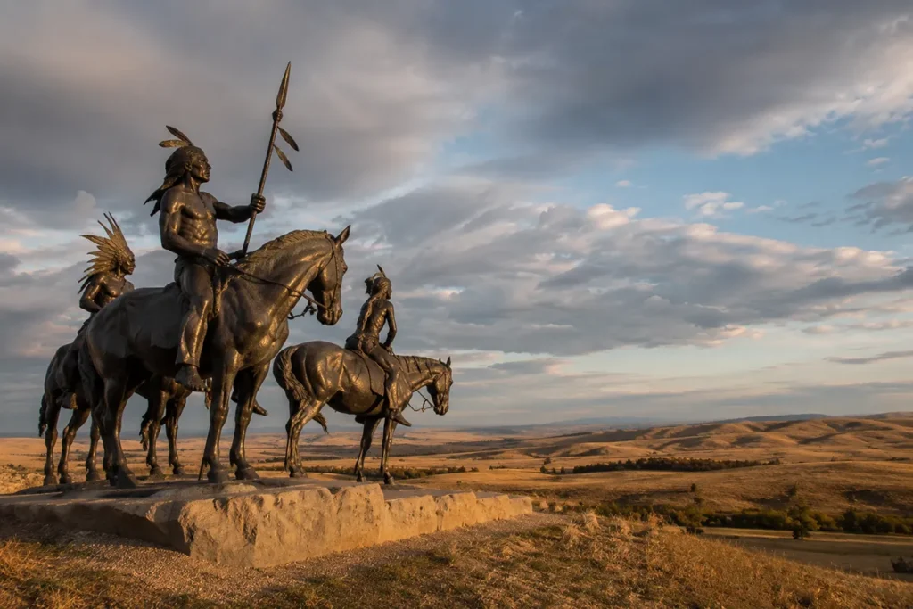 Indian Memorial at Little Bighorn Battlefield National Monument in Montana with rolling prairie hills in the background
