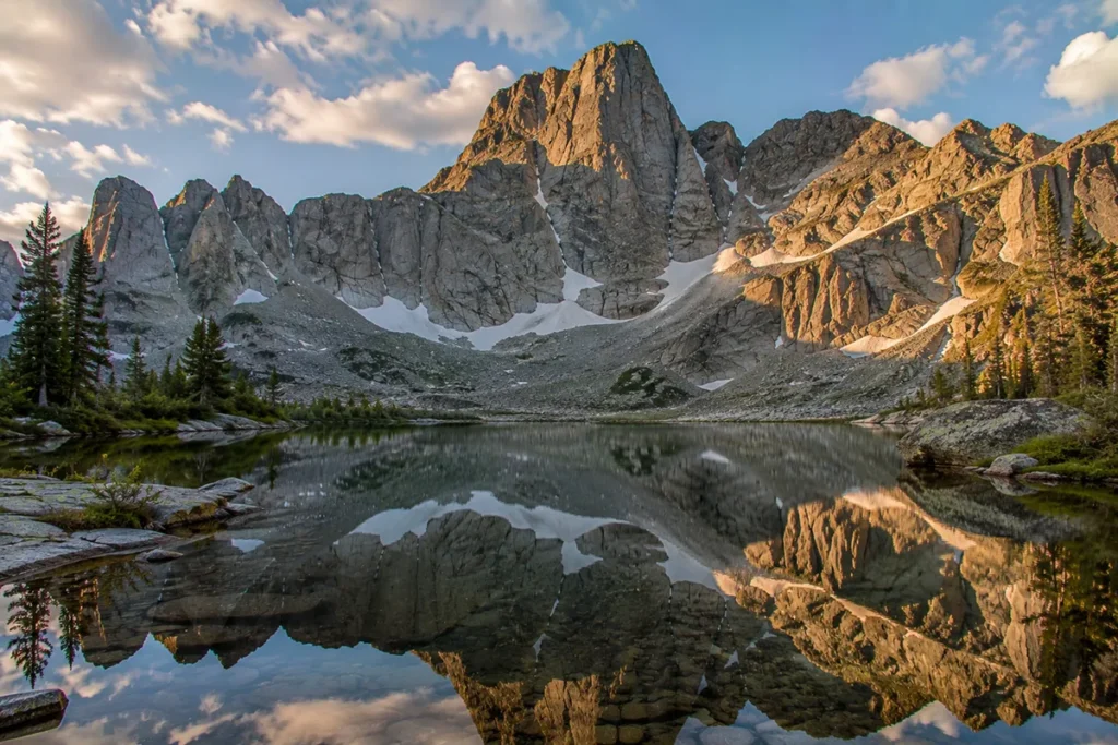 Snowshoe Peak rising above an alpine lake in the Cabinet Mountains Wilderness