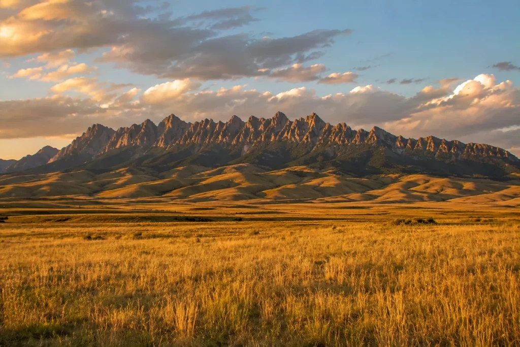 The Mount Powell and Deer Lodge Mountain ridgeline forming a distinctive silhouette above I-90