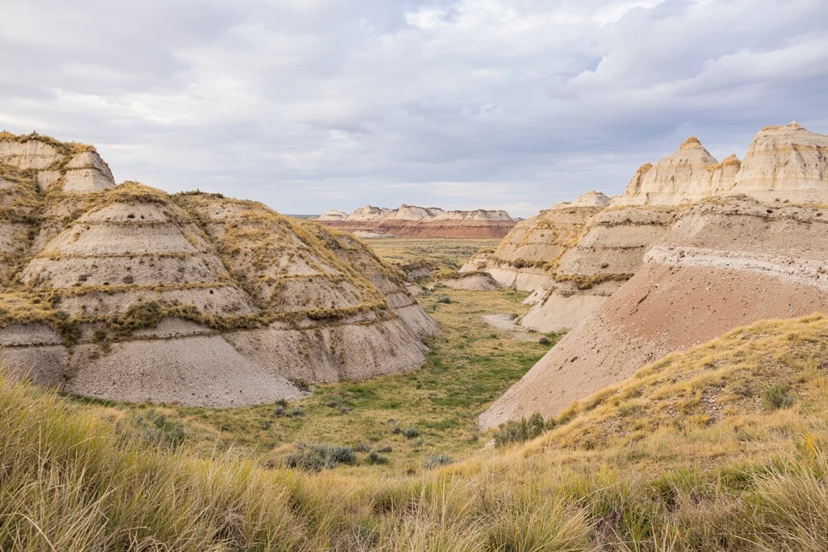 Dramatic badlands formations at Makoshika State Park near Glendive, with layered clay buttes and sparse prairie vegetation