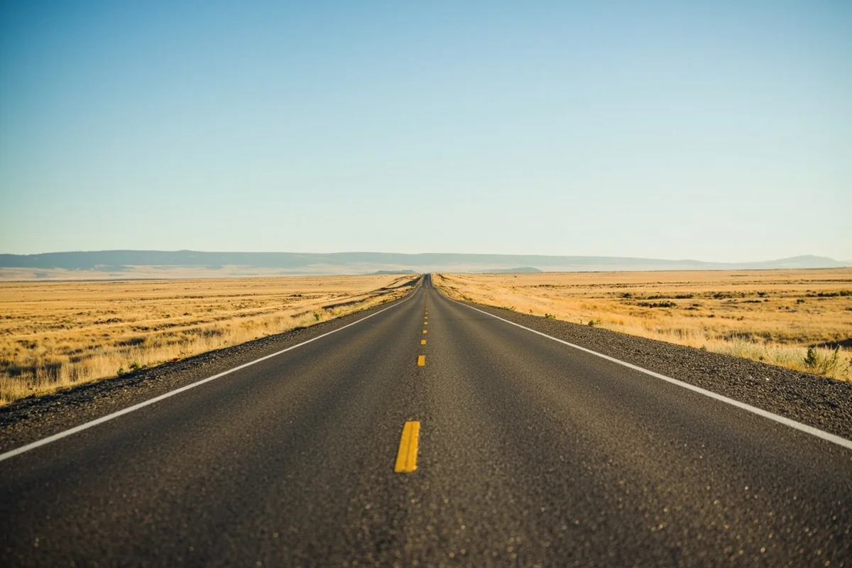 Montana Highway 5 stretching across open prairie toward the horizon in Sheridan County