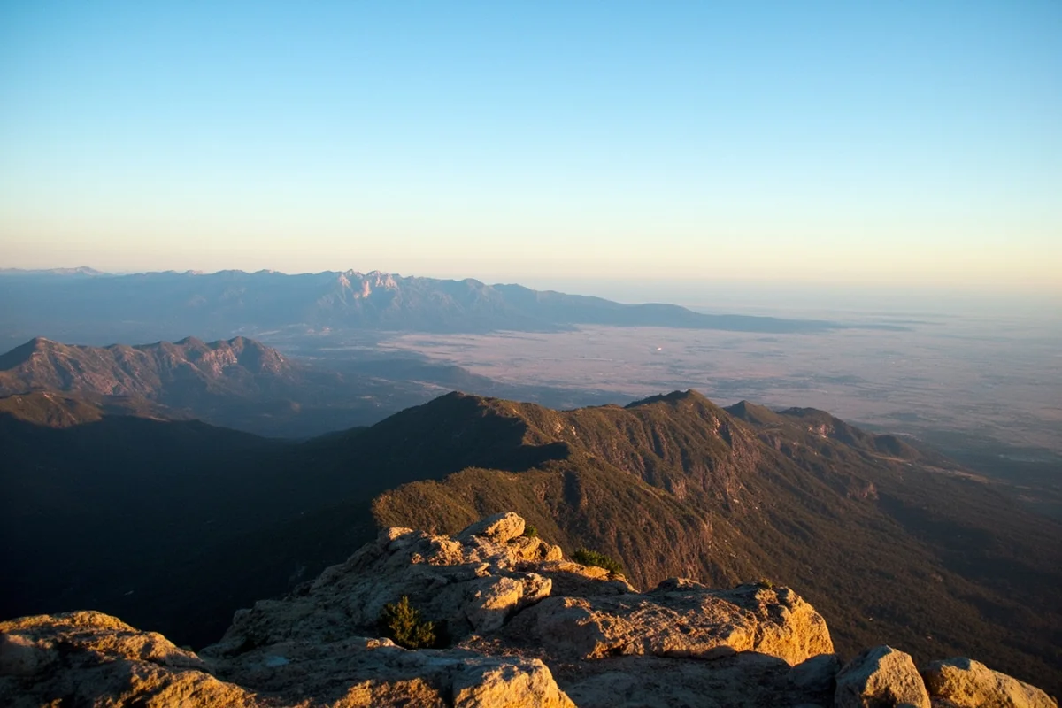 Panoramic view from Chief Mountain showing mountains meeting plains