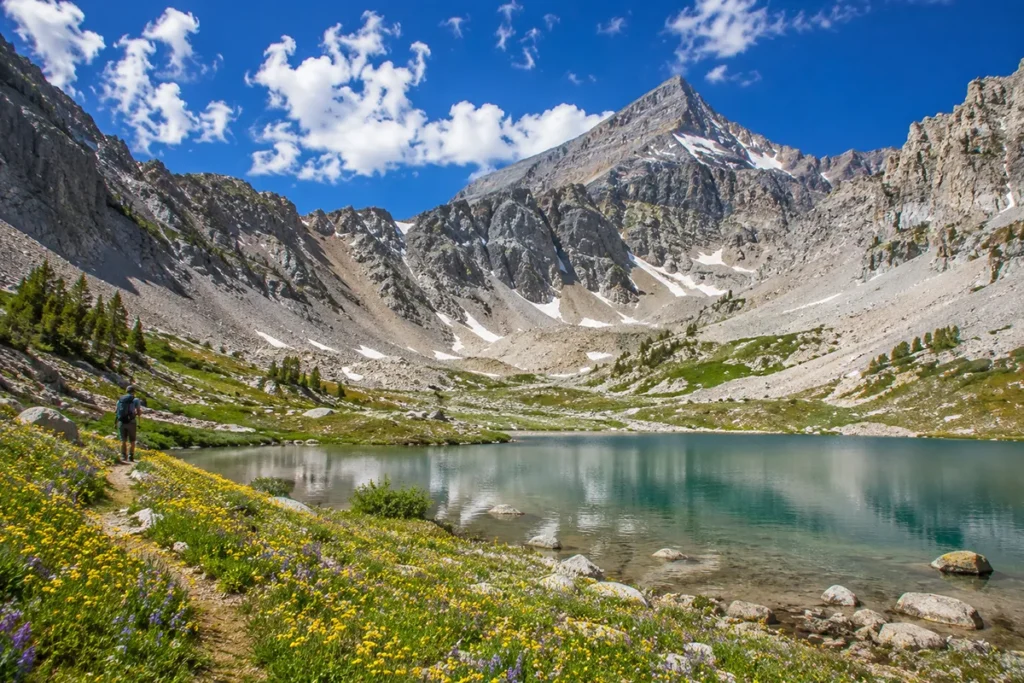 Beehive Basin glacial cirque near Big Sky Montana showing the crystalline alpine lake and Lone Peak rising behind in summer