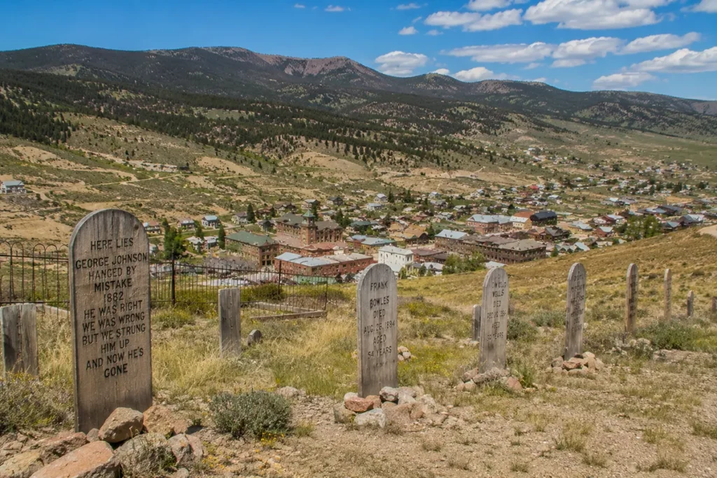 Boot Hill Cemetery overlooking Virginia City Montana where vigilante outlaws are buried with wooden grave markers visible
