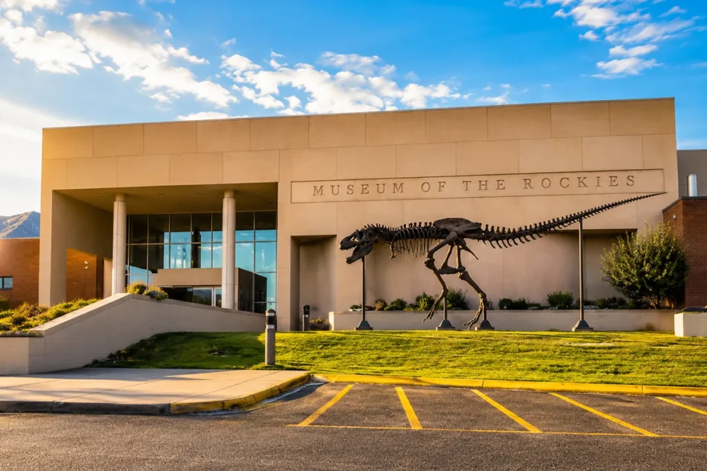 Exterior of Museum of the Rockies building in Bozeman, Montana with mountain backdrop