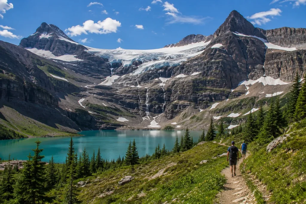 Grinnell Glacier in Glacier National Park Montana showing the remaining glacier and turquoise Lake Josephine below in summer
