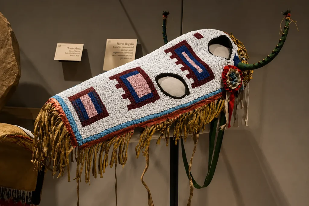Historic Blackfeet beadwork and horse gear on display representing Northern Plains material culture